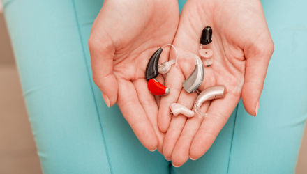 Holding Hearing Aid Parts in Hands